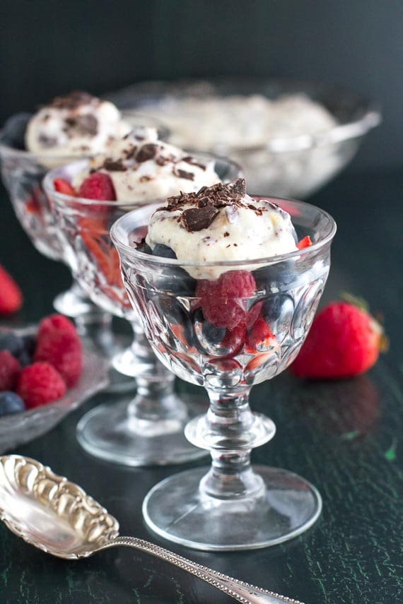 Cannoli cream on berries in small glass goblet