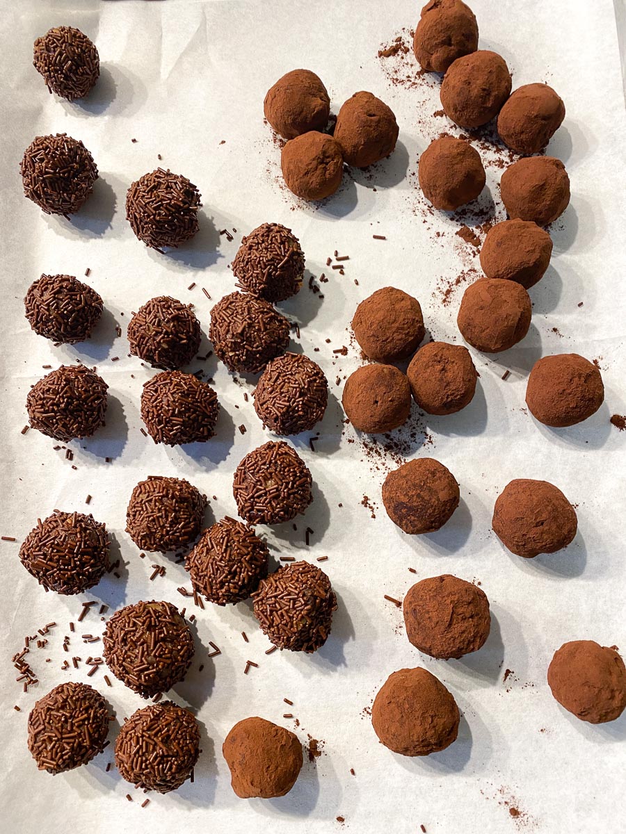 https://www.fodmapeveryday.com/wp-content/uploads/2021/12/troufakia-rolled-into-balls-on-parchment-lined-pan.jpg