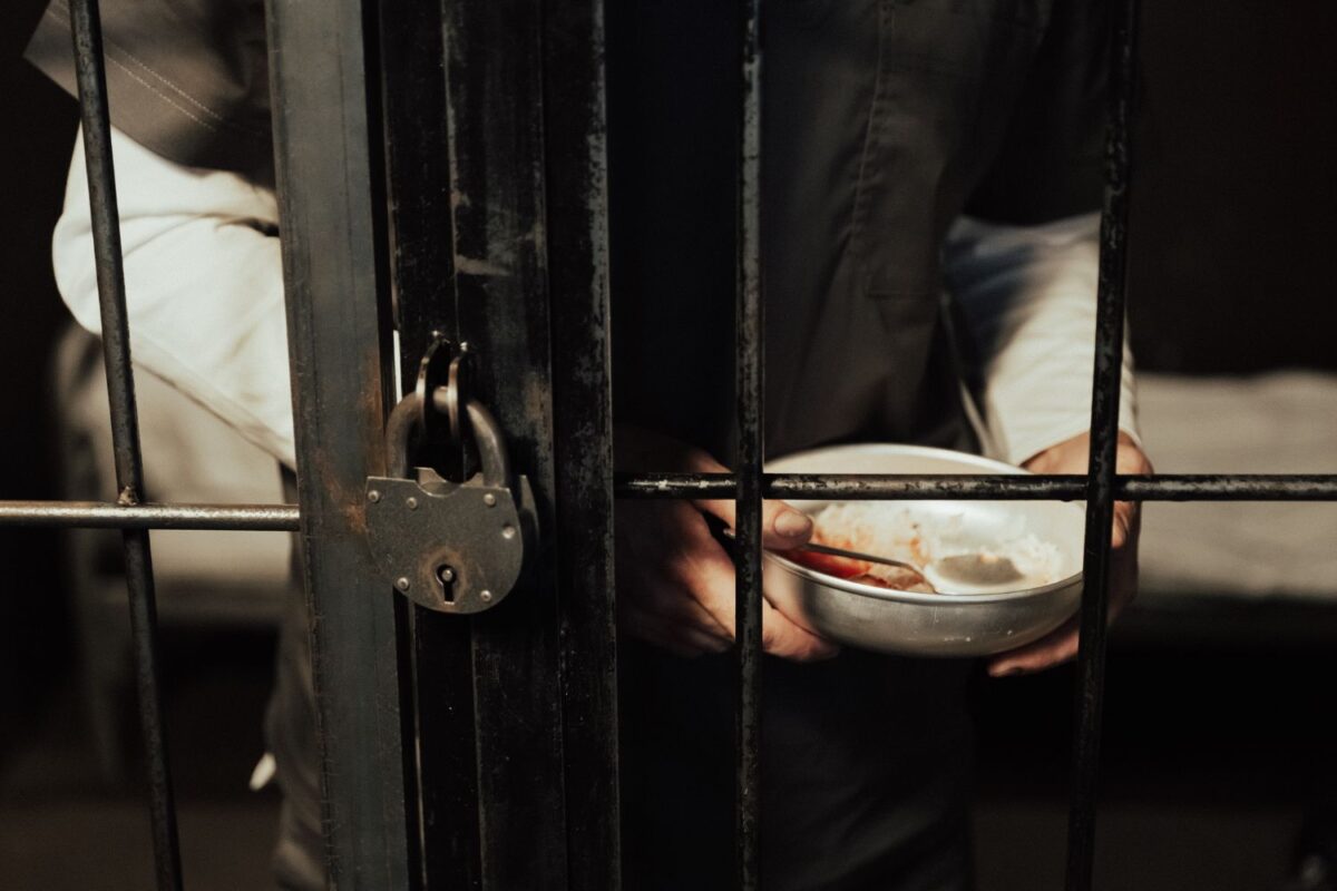 prisoner with empty bowl