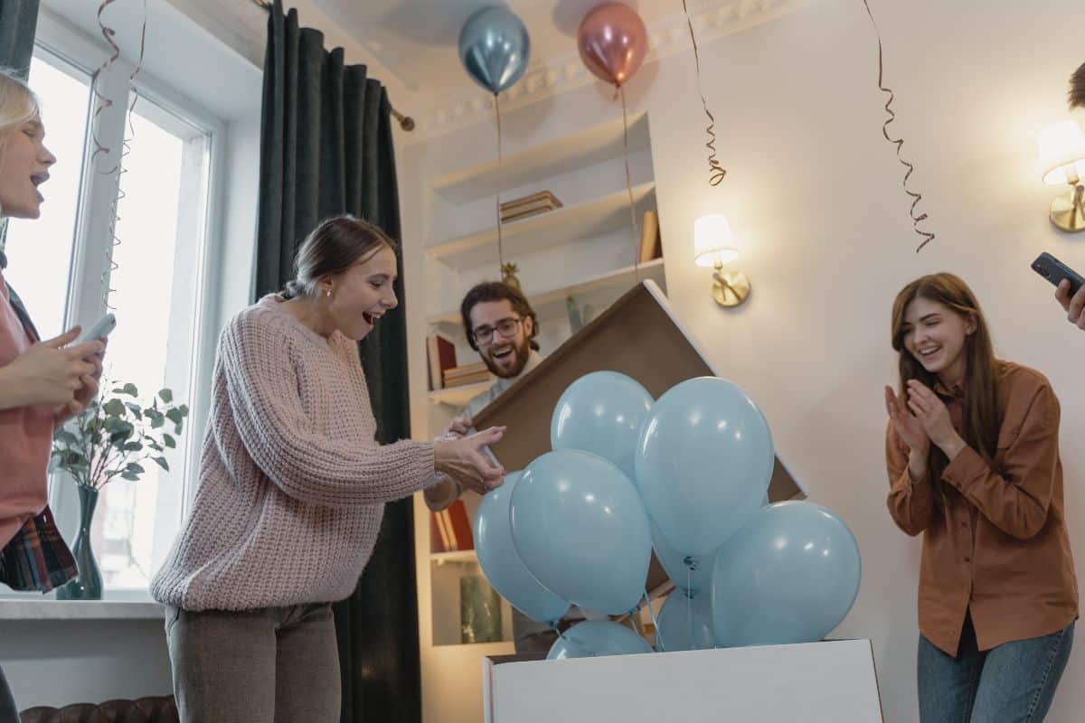 Pregnant Woman Excitedly Looking at the Blue Balloons during the Gender Reveal