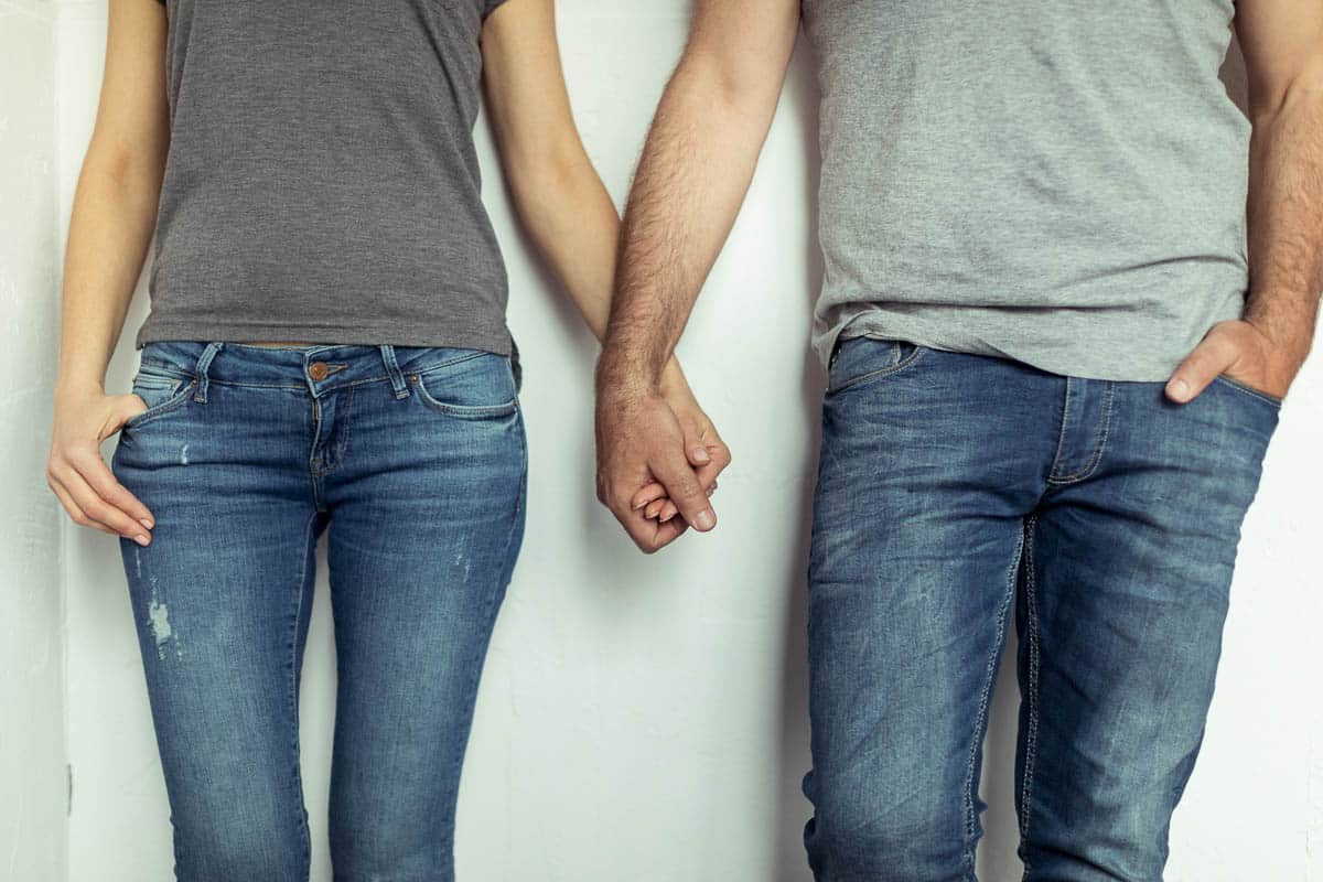 man and woman in jeans.