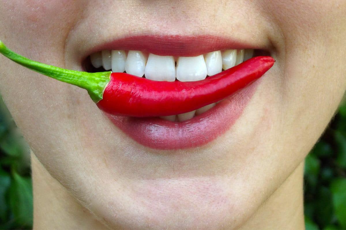 woman eating a chile.