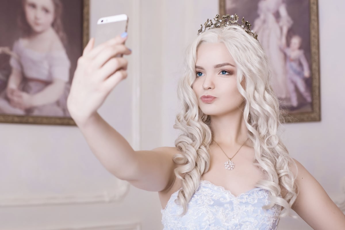 Blonde girl taking selfie