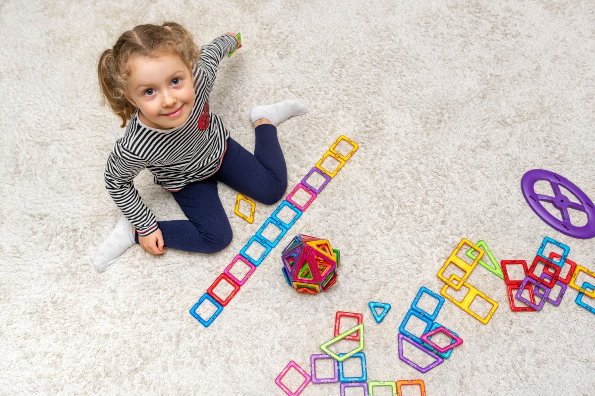 Little girl playing with Magnetix