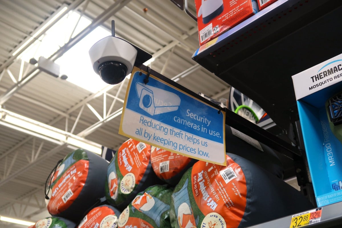 Security camera in use at Walmart. Reducing theft helps us all by keeping prices low. Monitor for shoplifting.