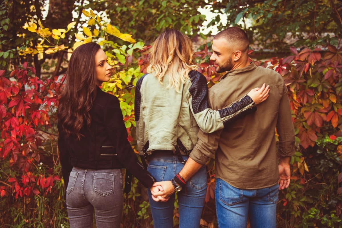 threesome. man and two women cheating. 