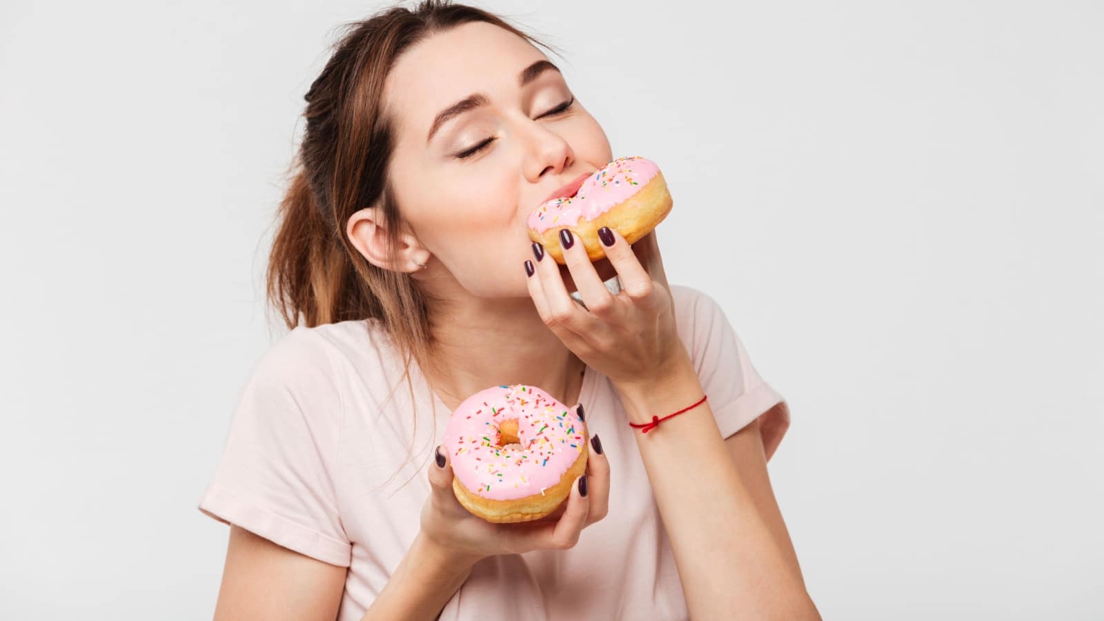 woman eating donuts.