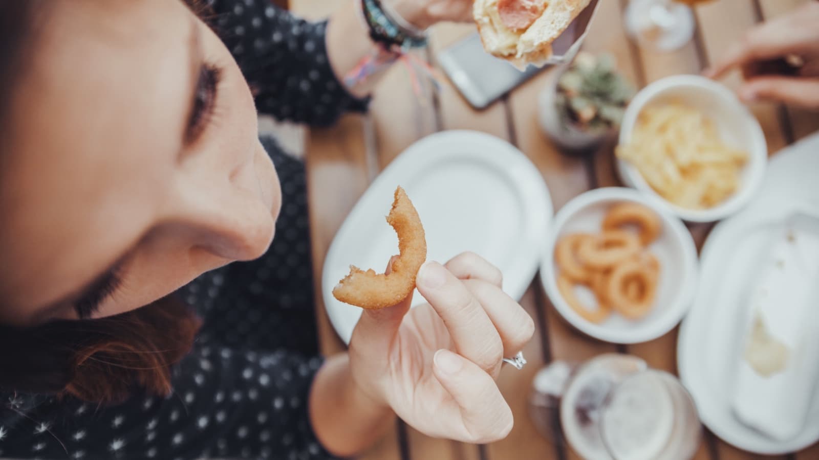 Eating onion rings. 