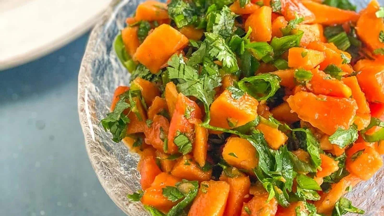 Papaya-Salsa-in-clear-bowl-in-blue-surface-very-closeup-image.