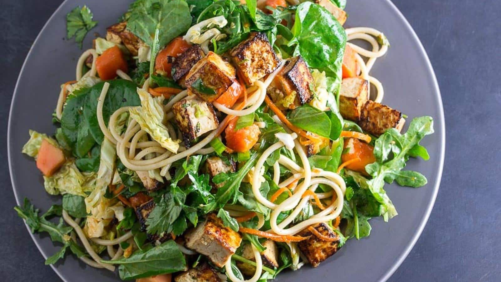 Asian-Tofu-Noodle-Papaya-Salad-on-a-gray-plate.