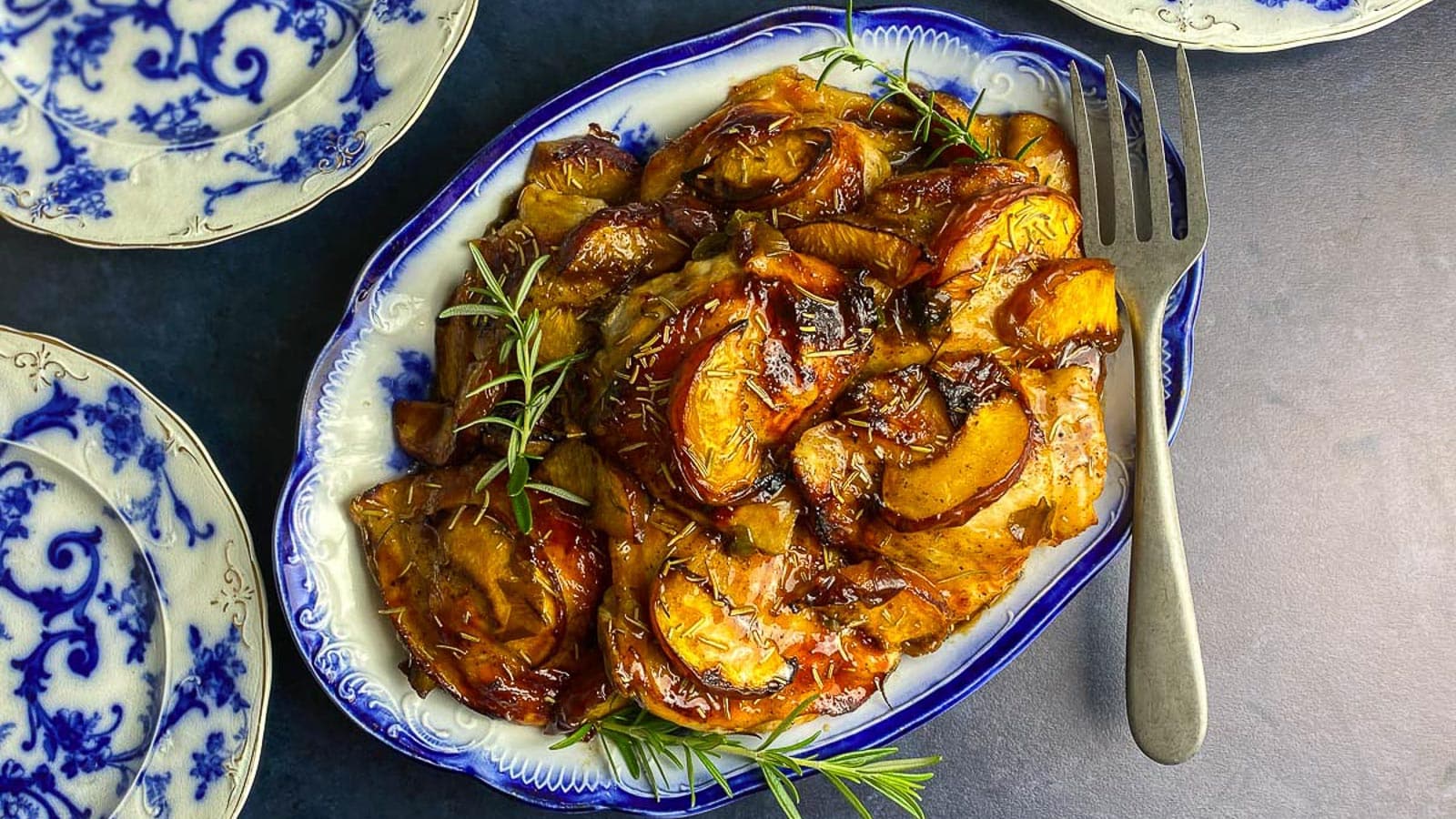 Chicken-with-peaches-and-rosemary-on-decorative-blue-and-white-oval-platter-1.