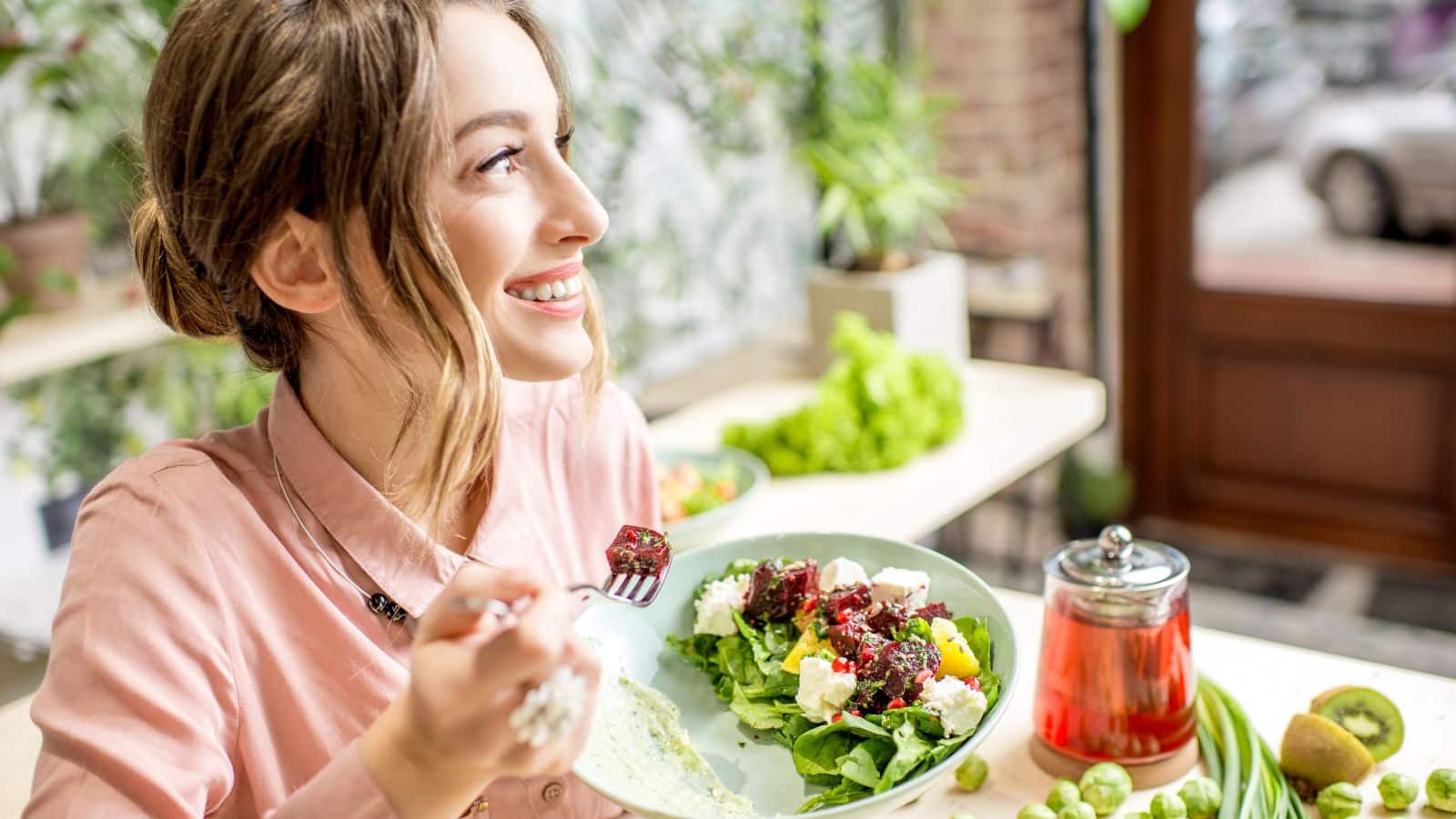 woman eating salad