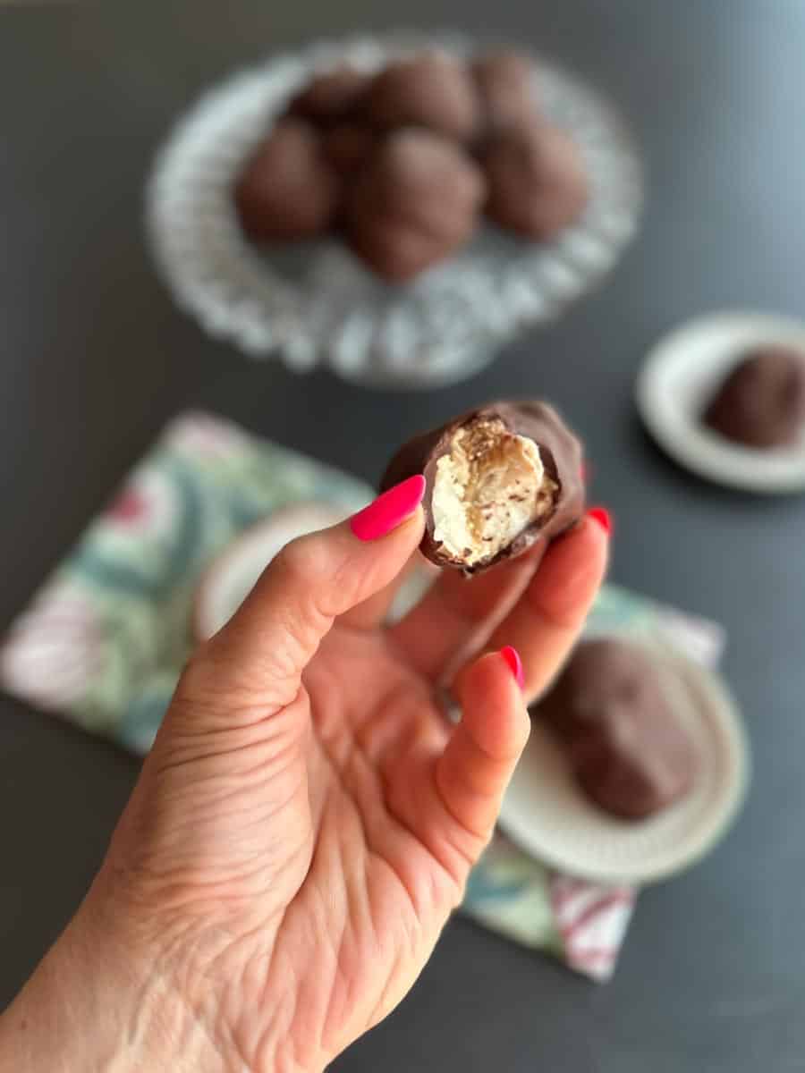 Low FODMAP Frozen Chocolate-Dipped Peanut Butter Banana Bites, bitten in half.