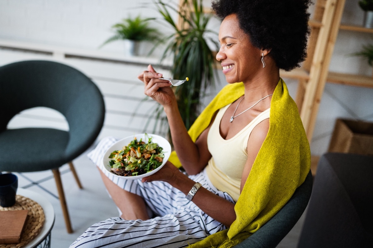 Happy woman eating. 