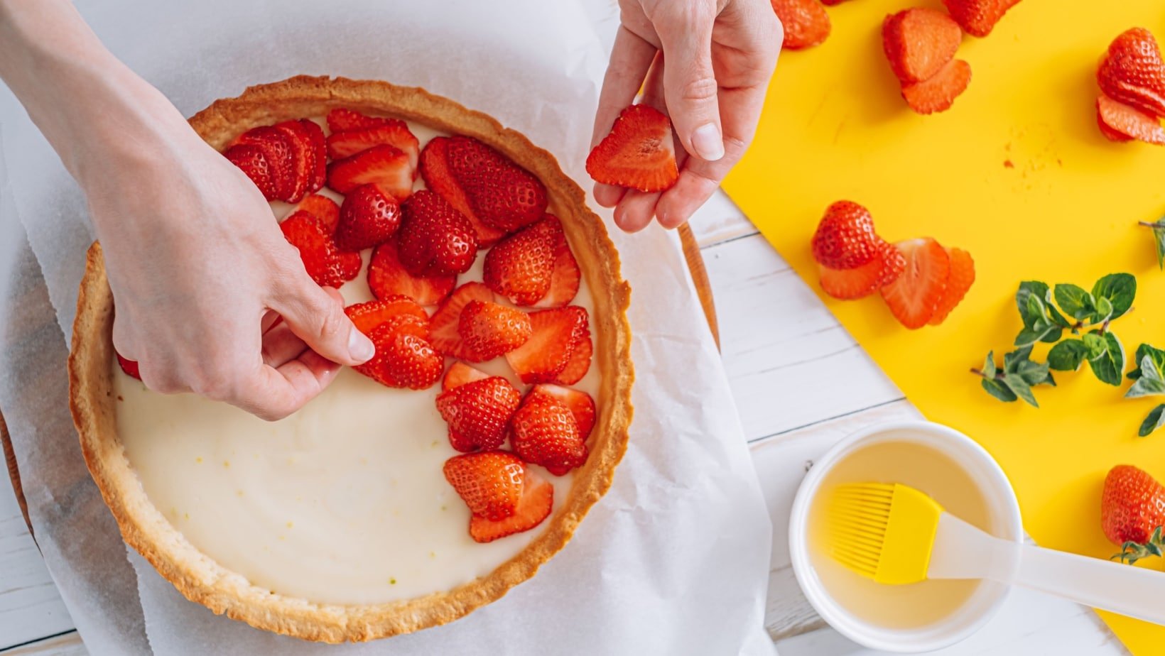 making strawberry tart. 