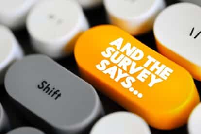 And The Survey Says is a phrase often used in the context of presenting or revealing the results of a survey or poll, text concept button on keyboard