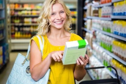 woman holding cereal box.